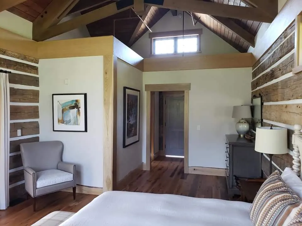 Spacious master bedroom with vaulted ceiling designed by Banded Construction