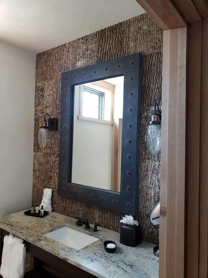 Rustic bathroom vanity with vessel sink installed by Banded Construction
