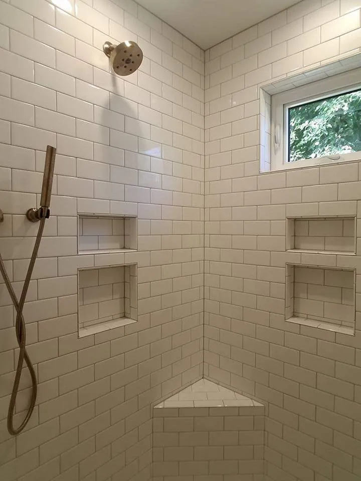 Custom subway tile shower installation by Banded Construction in Omaha